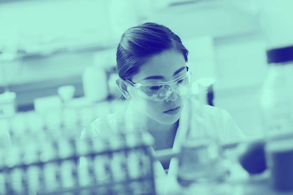 Blue washed image of female in lab