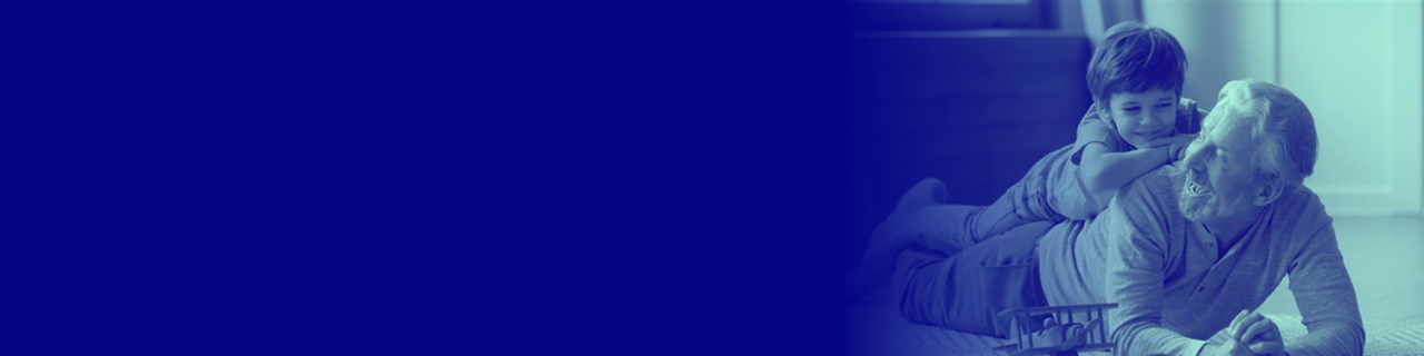 blue washed image of child laying on fathers chest with arms folded