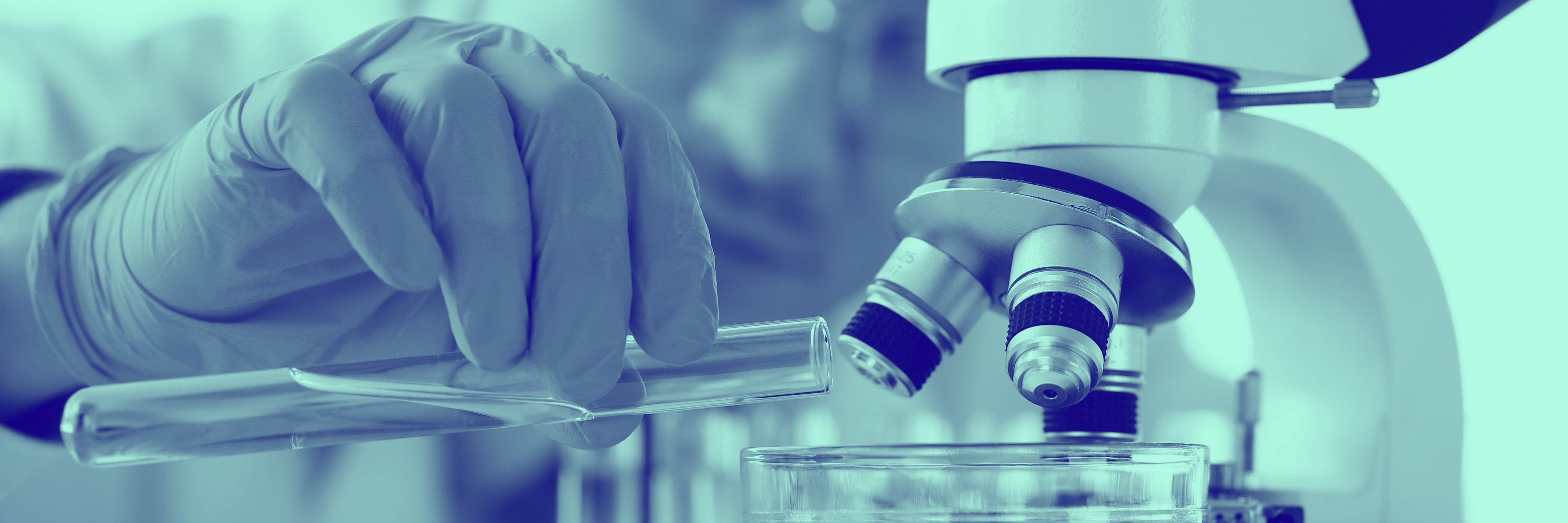 Blue washed image of scientist in lab pouring test tube