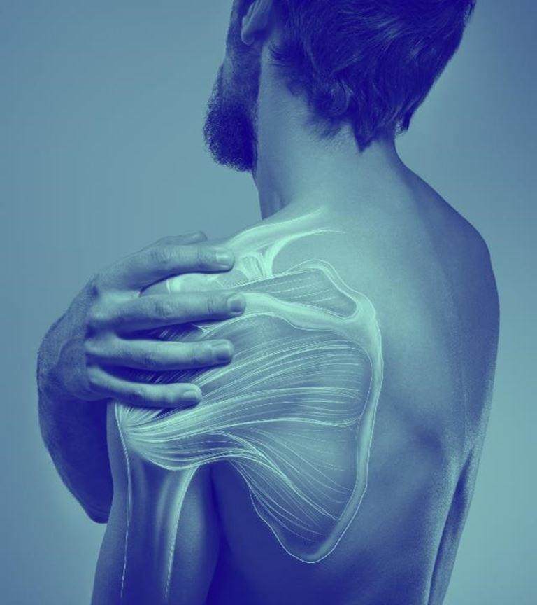 Blue washed image of male touching his shoulder