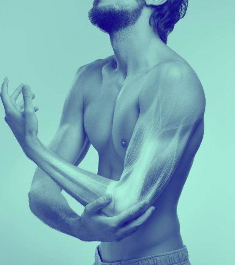 Blue washed image of Man touching elbow