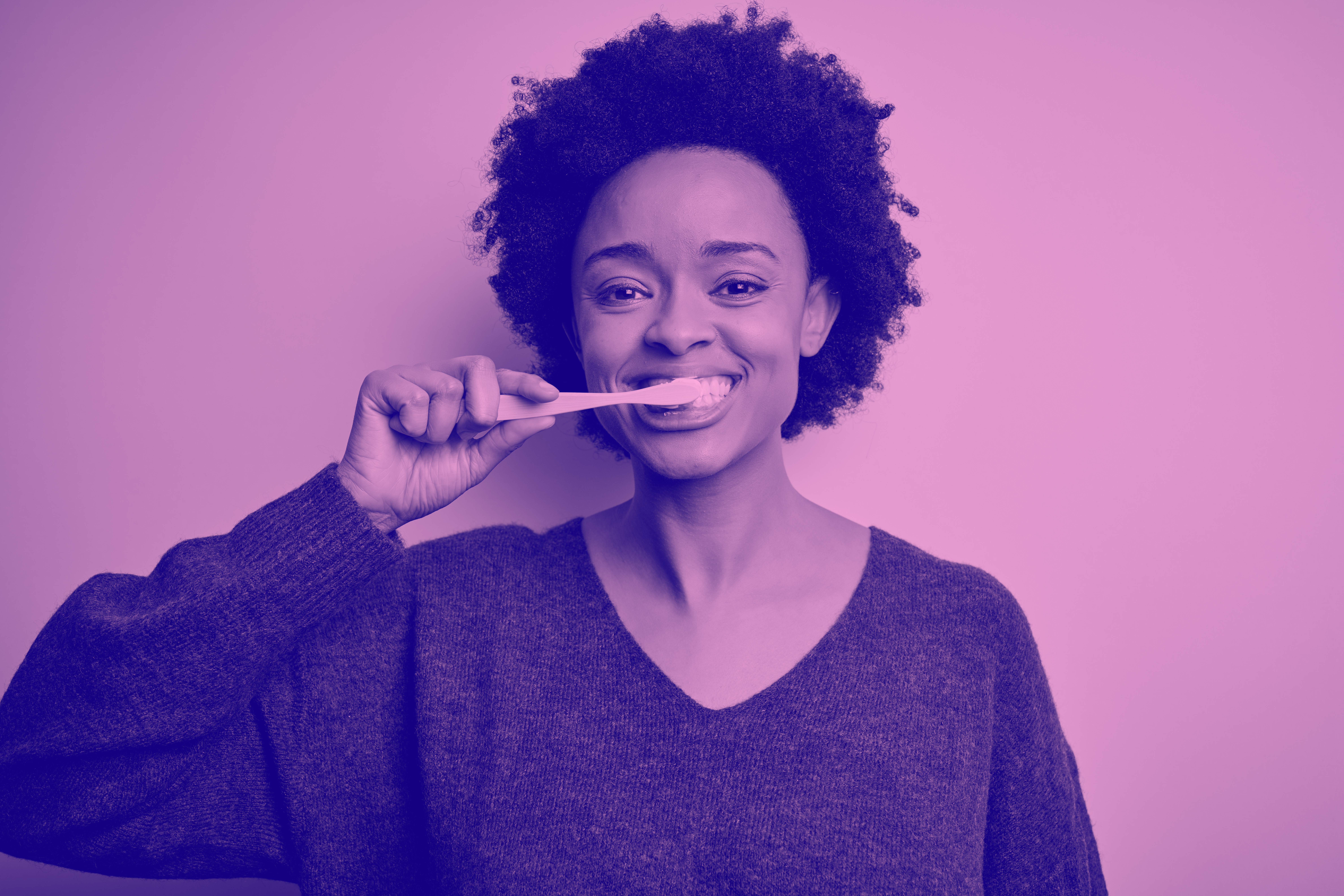 woman brushing her teeth