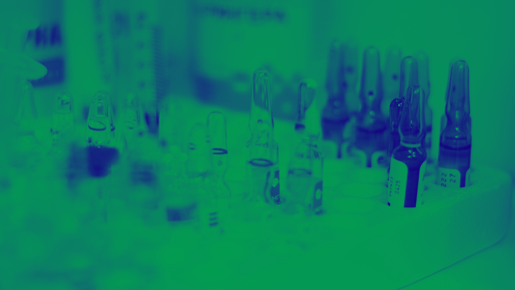 green and blue washed image of ampules in lab