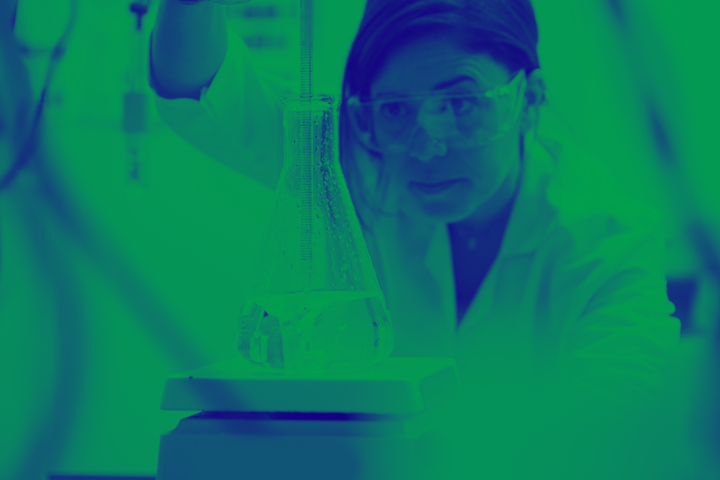 blue and green washed image of female in lab