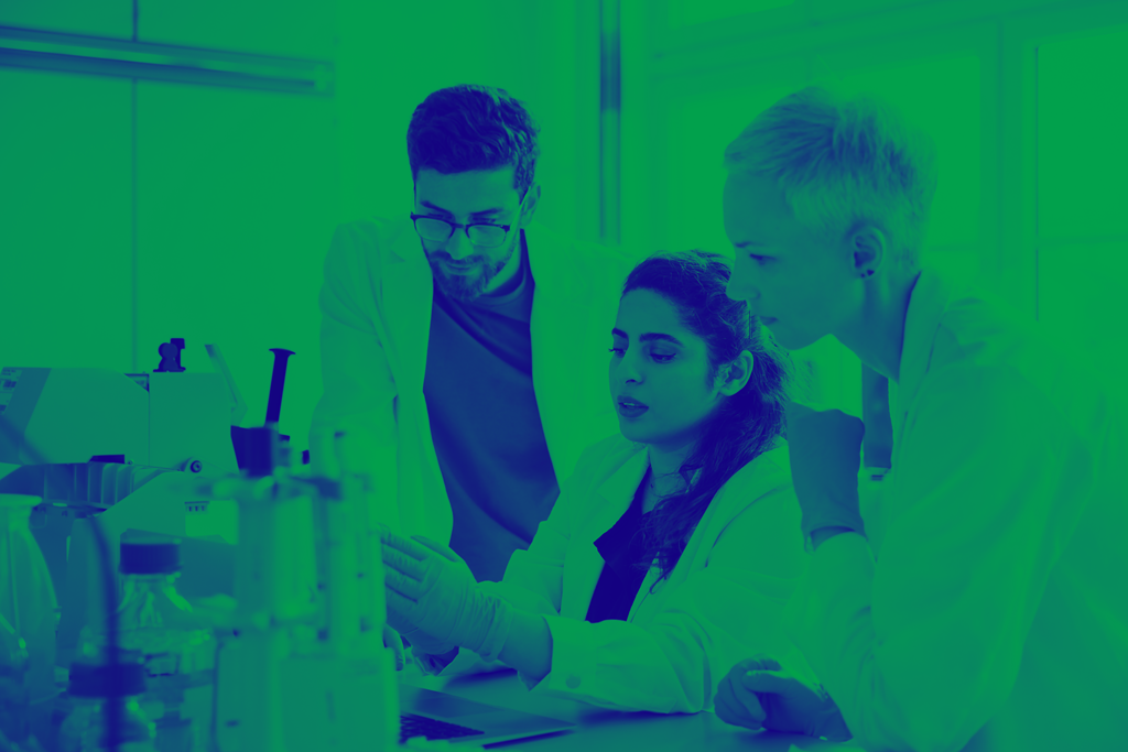 Green and blue washed image of three people in a lab
