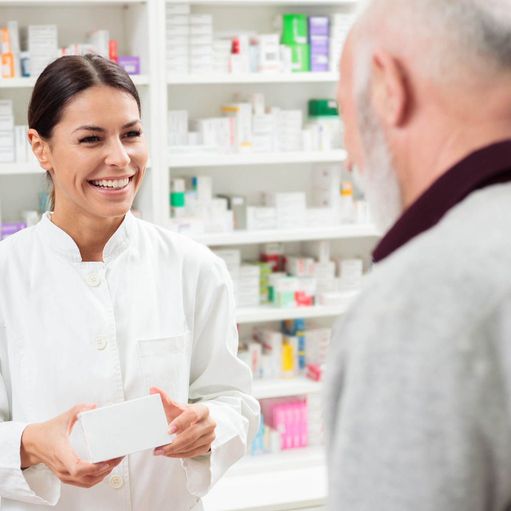 Pharmacist with consumer in a pharmacy