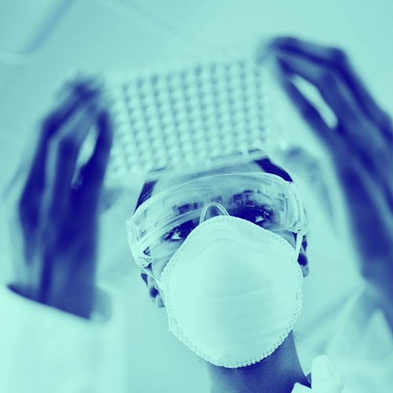 woman in lab with blue wash