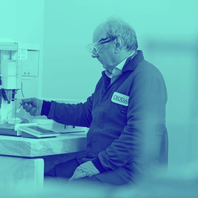 man in lab with blue wash over image