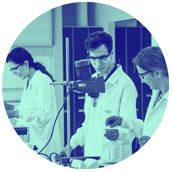 image in circle of people working in a lab