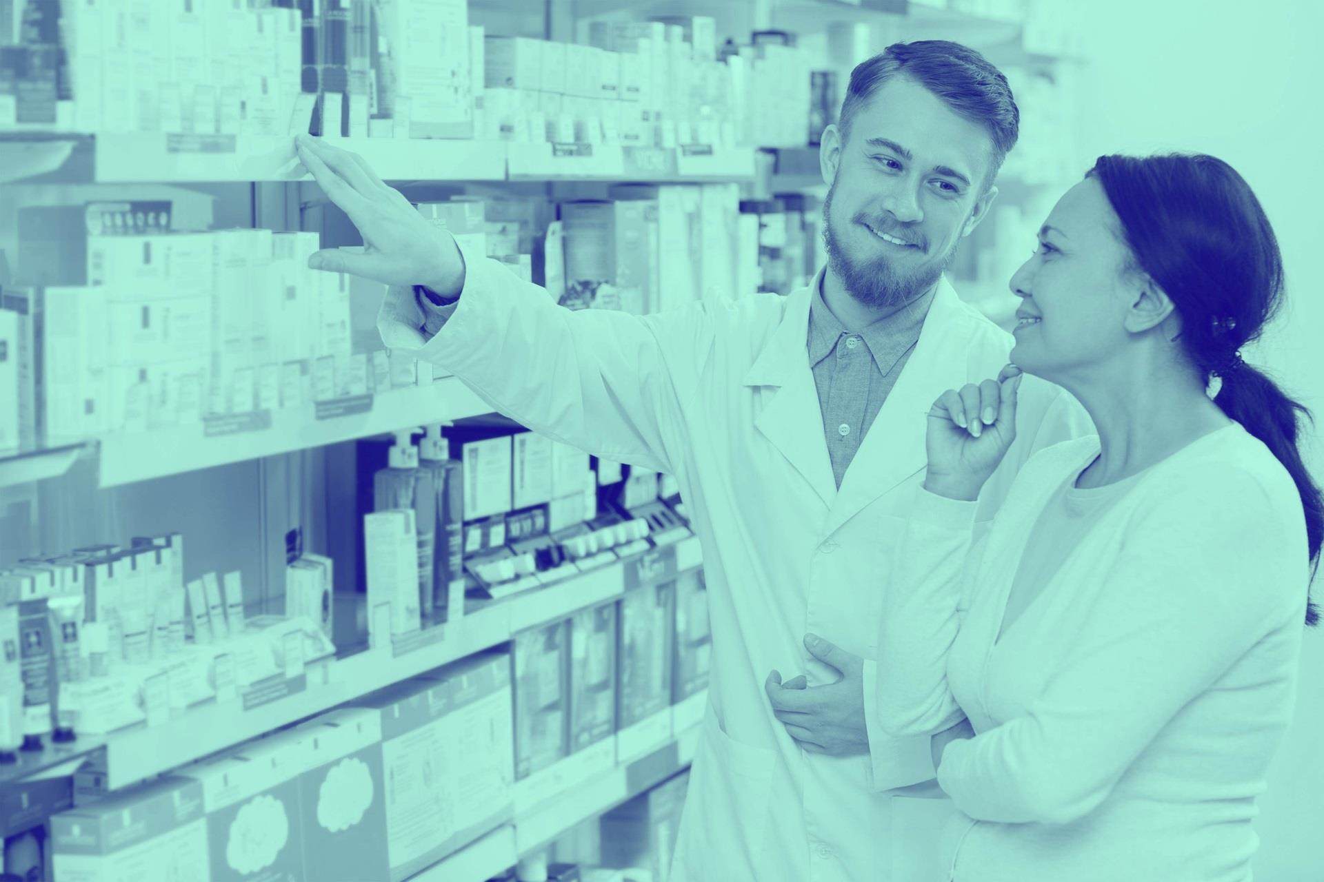 Male pharmacist woking with his client