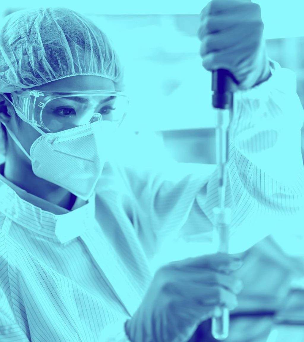 image of woman in a lab formulating with an adjuvant system