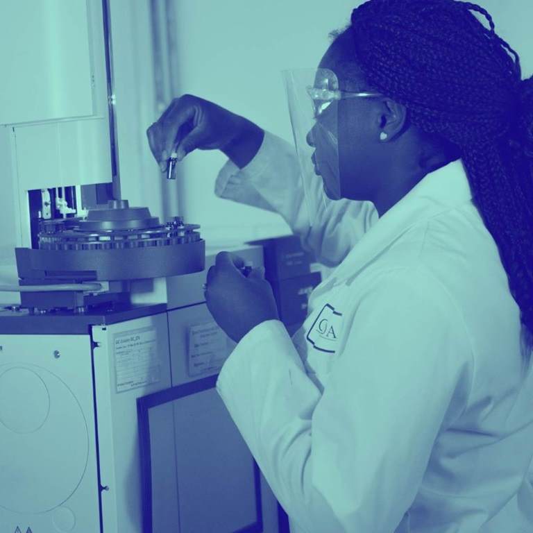 woman in lab formulating with adjuvants